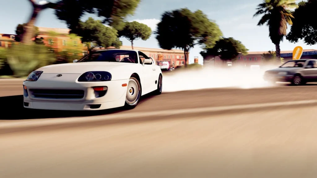 Biała Toyota Supra czwartej generacji w dynamicznym ujęciu podczas driftu na ulicy